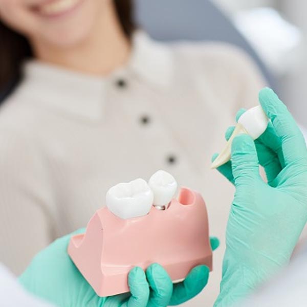 Que problemas causam a perda de dentes?